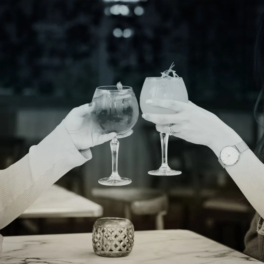 Clinking cocktail glasses
